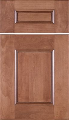 Eclipse Aspen, Two wooden cabinet doors with a raised panel design and a medium brown finish. The upper door is smaller with a rectangular panel, while the lower door is larger with a square panel