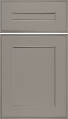 Eclipse Essex, A gray cabinet door with a raised panel design and subtle trim details, featuring a matching drawer front above with coordinated molding