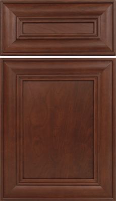 Eclipse Kendall, Close-up of a wooden cabinet door with a rich, dark brown finish and a raised panel design. The wood grain is visible, and the door has decorative rectangular molding around the edges