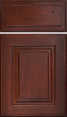 Eclipse Oxford Raised Panel, A wooden cabinet door and drawer front with a rich, reddish-brown finish, featuring a raised rectangular panel design and visible natural wood grain patterns