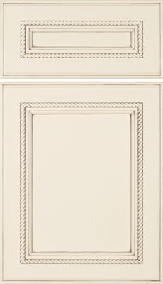 Eclipse Shelby, Cream-colored cabinet door with a rectangular raised panel design, featuring decorative rope-like trim on both the upper drawer panel and the main door panel. The style gives a classic, elegant appearance