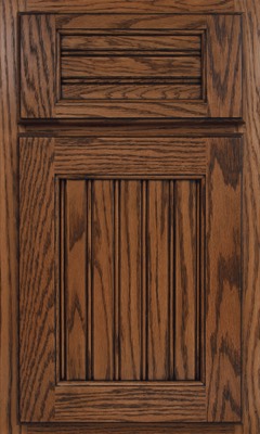 Shiloh Beaded Century, A wooden kitchen cabinet door with a raised panel design, featuring vertical grooves on the lower section and horizontal slats on the upper panel. The medium brown finish highlights the visible grain
