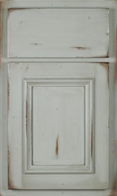 Shiloh Charleston, Distressed white wooden cabinet door with a rectangular raised panel and matching upper drawer front, featuring chipped paint and worn edges for a vintage, rustic look