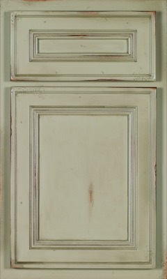 Shiloh Glenbrook, Distressed, off-white kitchen cabinet door and drawer front by Bethesda Cabinets, featuring raised panels with visible wood grain and worn edges for a rustic, vintage look