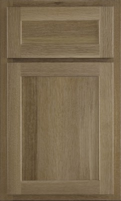 Shiloh Malibu, A wooden cabinet door with a natural oak finish, featuring a rectangular recessed panel design and visible wood grain patterns