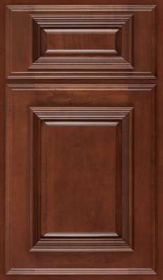 Shiloh Montgomery, A wooden cabinet door from Bethesda Cabinets with a rich brown finish and raised rectangular panels, featuring detailed molding and beveled edges