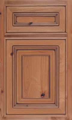 Shiloh Portland, A wooden cabinet door with a natural finish, featuring raised rectangular panels, decorative beveled edges, and visible wood grain with dark knots for a rustic appearance