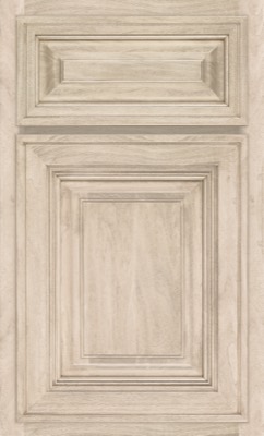 Shiloh Savannah, Light wood cabinet door by Bethesda Cabinets, featuring raised panels and decorative molding, a rectangular center panel with a smaller panel above it, and a natural wood grain finish