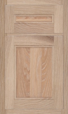 Shiloh Scottsdale, A close-up of a wooden kitchen cabinet door with a rectangular panel design and visible wood grain in light brown tones