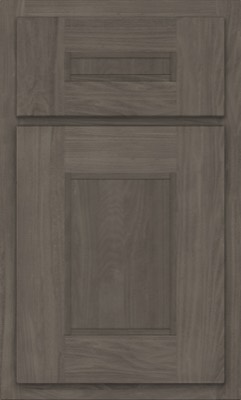 Shiloh Tahoe, A dark wood cabinet door from Bethesda Cabinets features a rectangular recessed panel and matching horizontal drawer front above