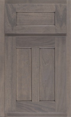 Shiloh Wilmington, A wooden kitchen cabinet door with a grayish-brown finish, featuring a simple, rectangular recessed panel design and subtle wood grain patterns