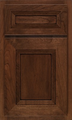Shiloh Windsor, A wooden kitchen cabinet door with a rich brown finish, featuring a rectangular raised panel in the center and a smaller horizontal panel above it, both with decorative framing
