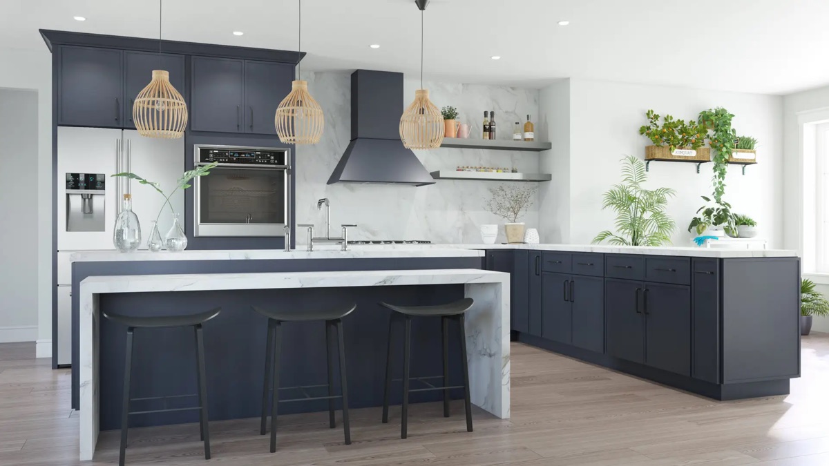 Modern kitchen by Bethesda Cabinets with navy lower cabinets, white uppers, a wood range hood, marble counters, and an island with bar stools.