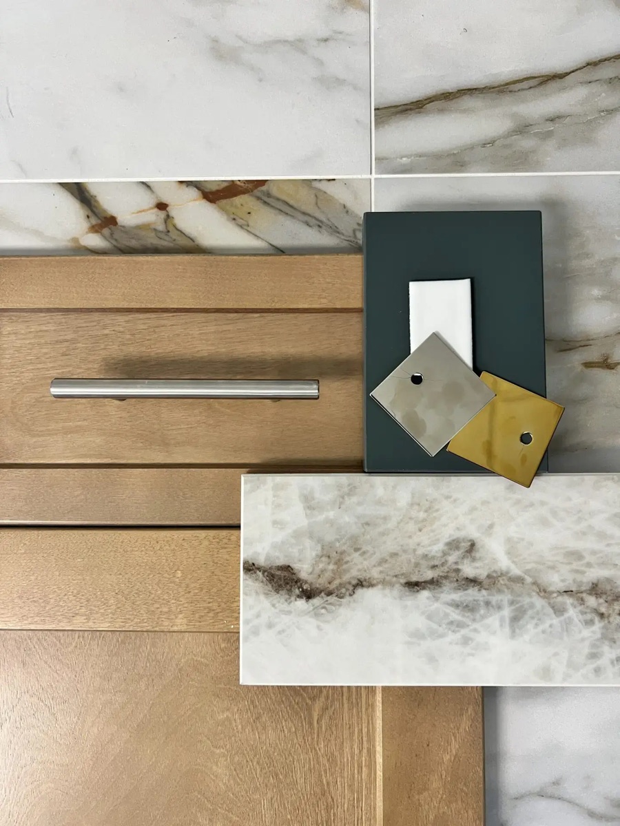 Customization options at Bethesda Cabinets with a wood cabinet sample, paint and finish chips, and a marble countertop sample.