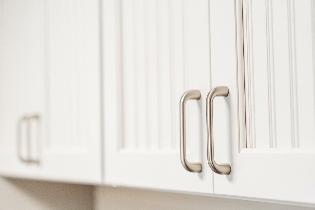 White cabinets with bar-pull hardware at the Bethesda Cabinets showroom in Bethesda, MD.