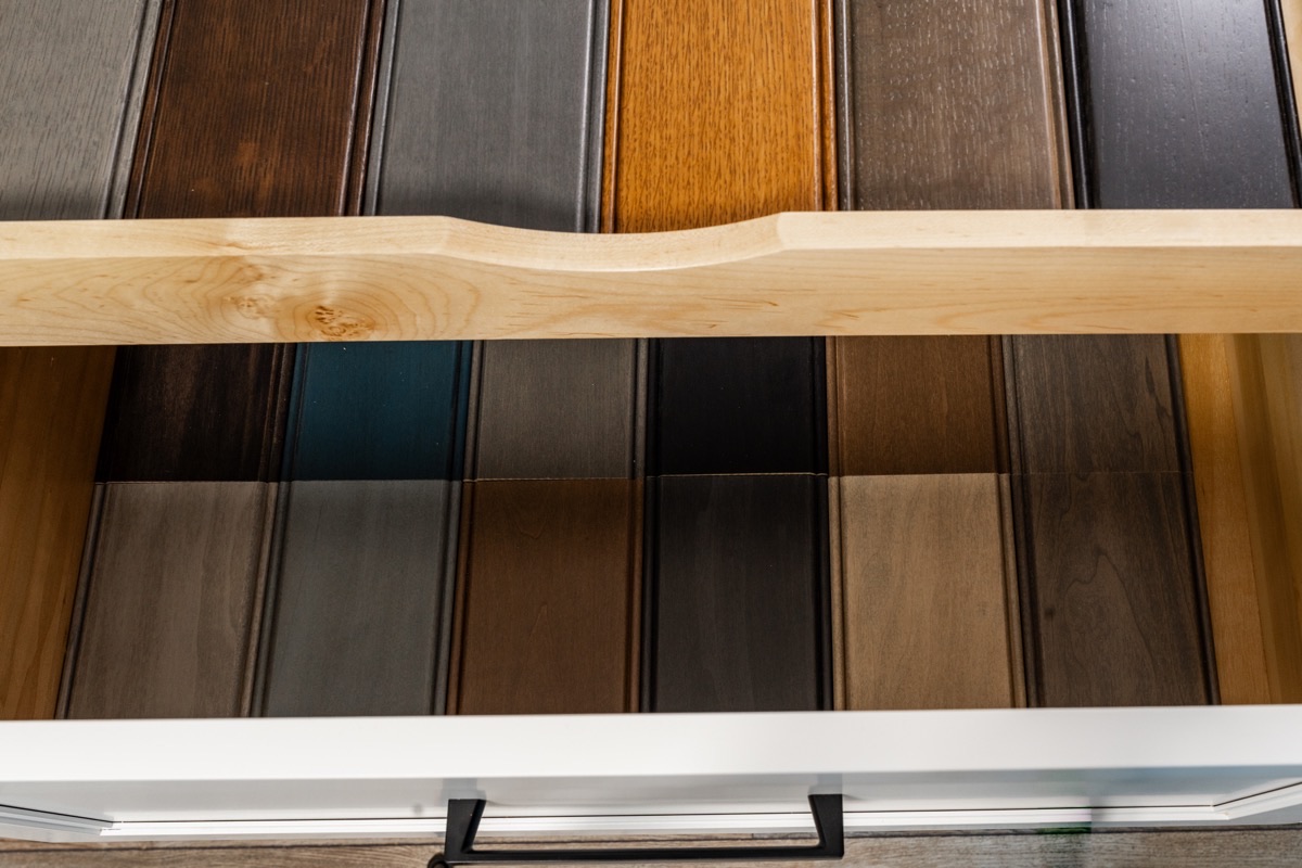 Wood door and finish samples in a range of stains at the Bethesda Cabinets showroom.