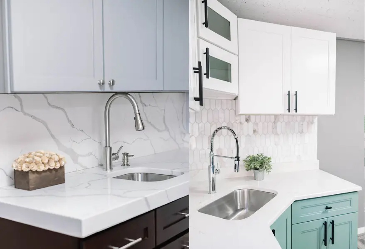 Kitchen display at the Bethesda Cabinets showroom with white and navy cabinets, a marble countertop, and an undermount sink.